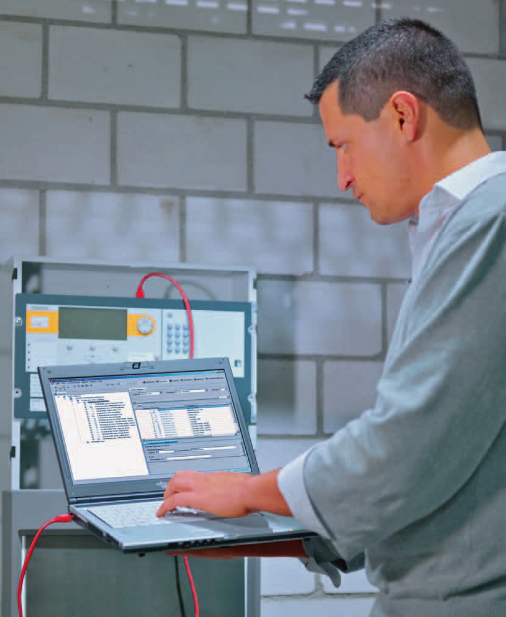 Engineer commissioning Cerberus Pro Fire Control Panel